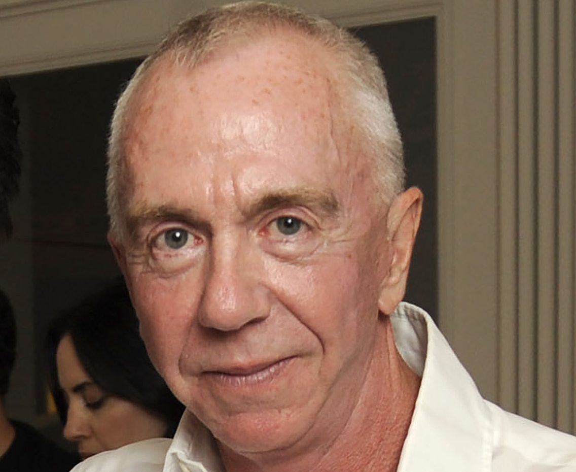 An elderly man, late gallerist Brent Sikkema, in a white shirt