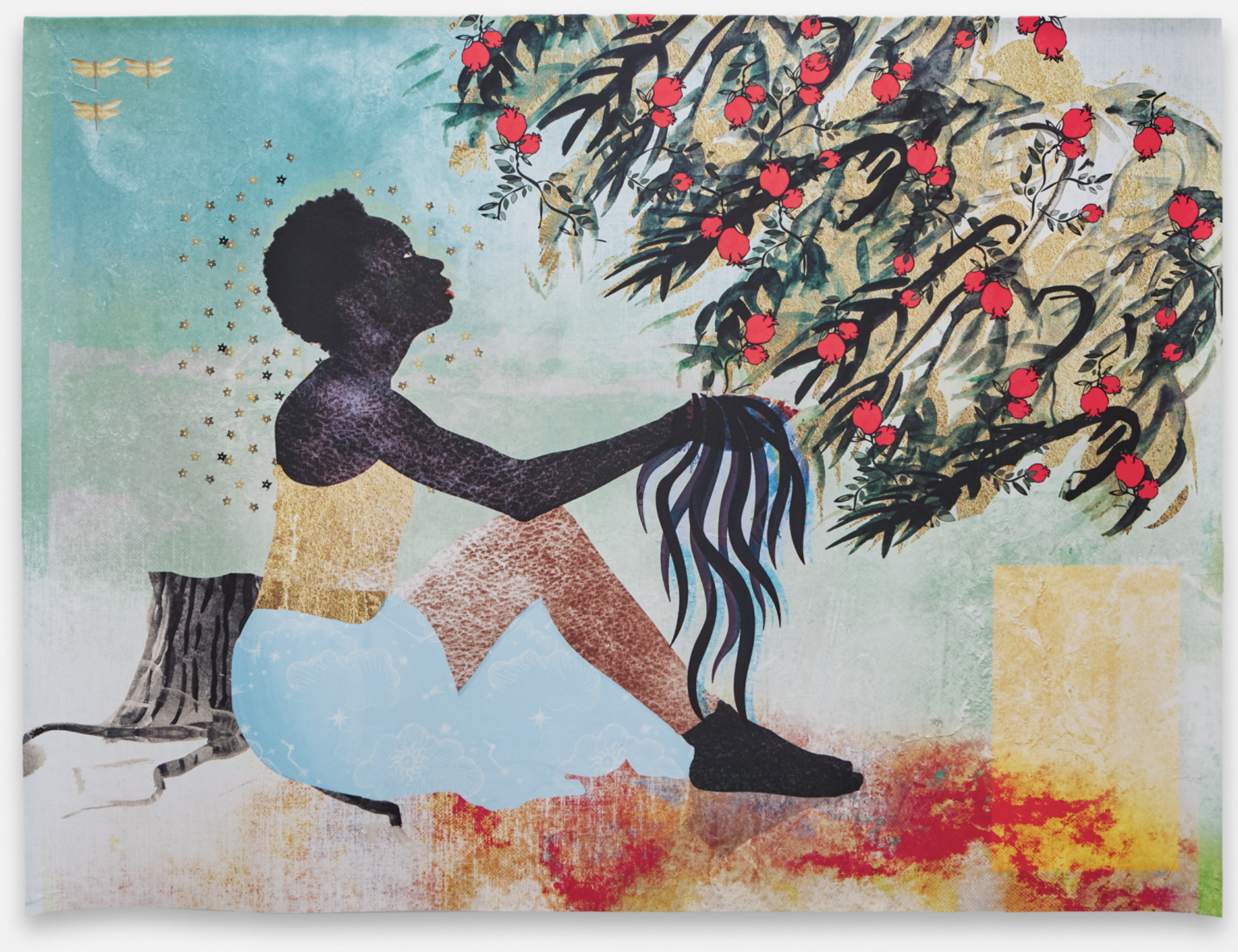 A black woman sitting with a powder blue skirt and yellow tank top looking up at bush or tree branches covered in vibrant red fruits, one of the liaison's picks.