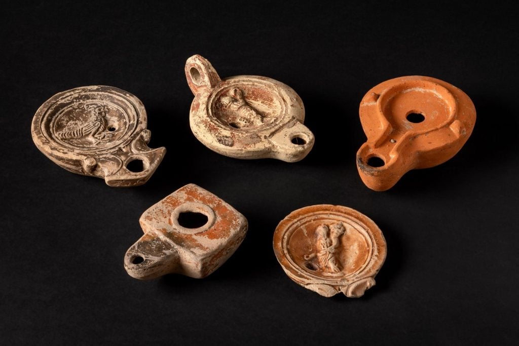 a collection of ceramic amulettes