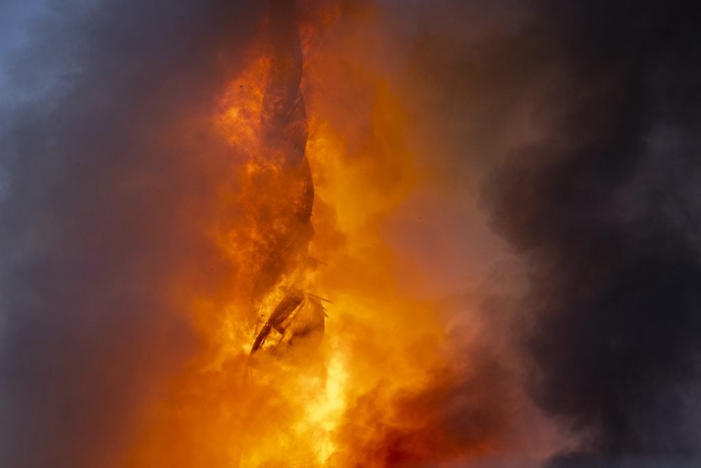 Flames engulf the spire of Copenhagen's historic stock exchange building