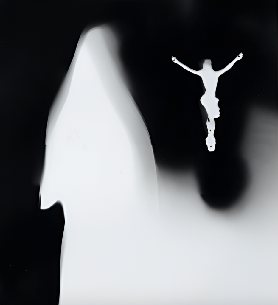 An abstract black and white photogram featuring a silhouette of a human figure with arms extended, superimposed over a soft-edged, ghostlike shape on a dark background.