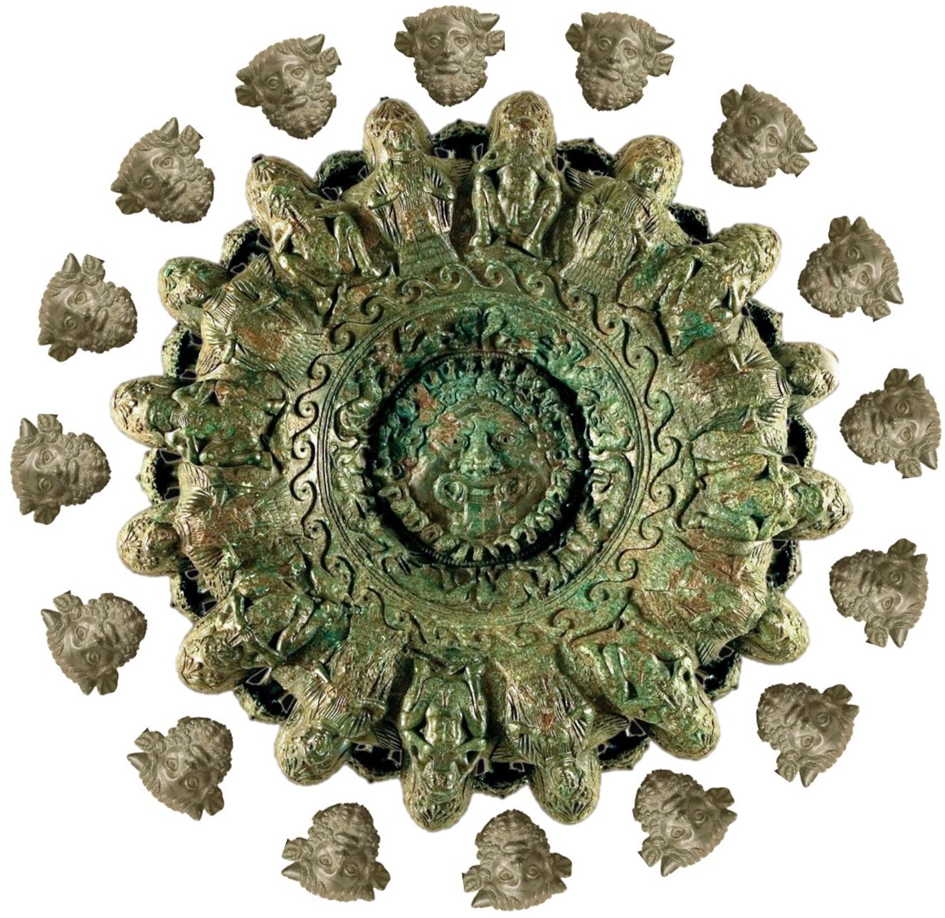 The intricately carved underside of a circular Etruscan bronze lamp, featuring a face at the center and seated figures along the rim