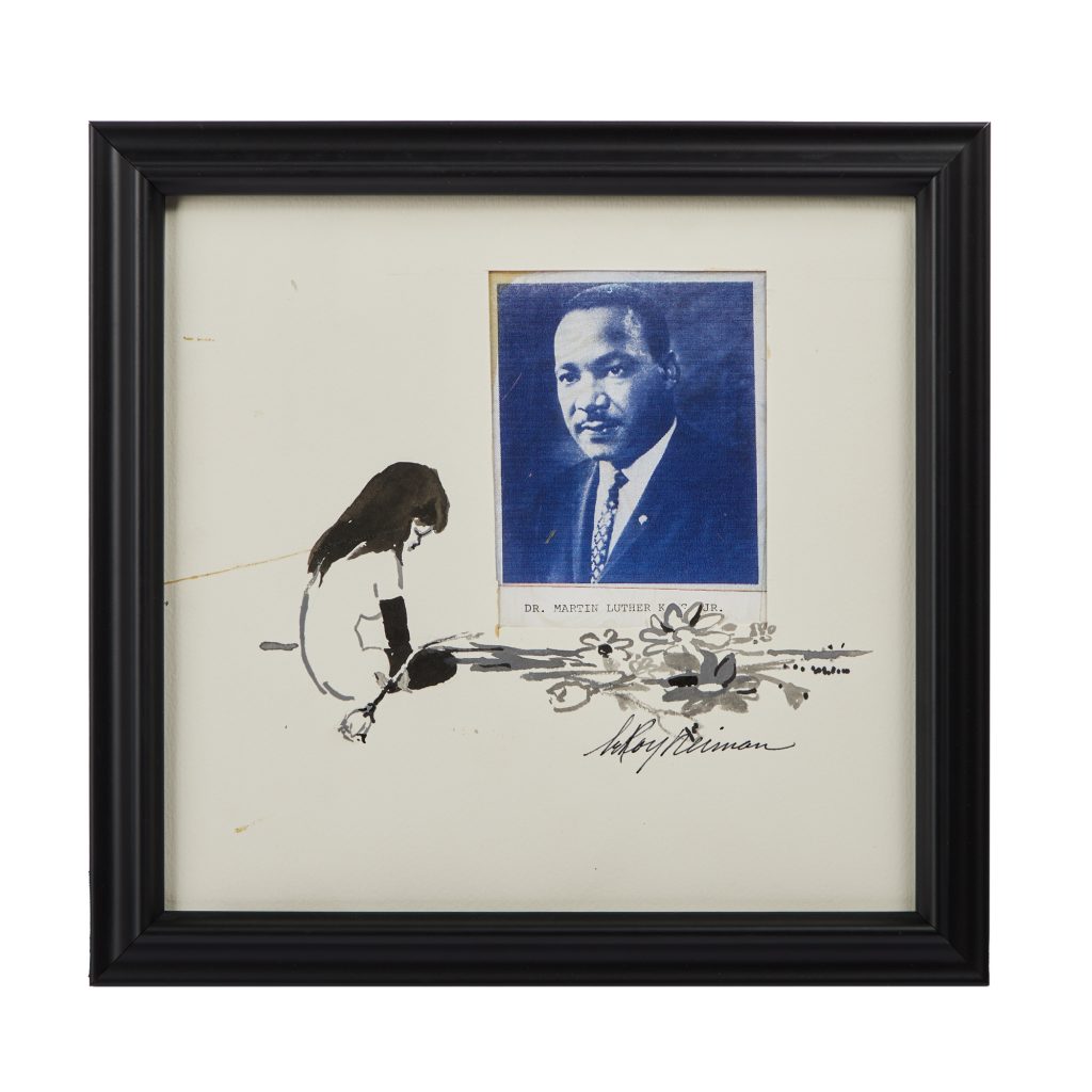 femlin in ink sits before a picture of Martin Luther King