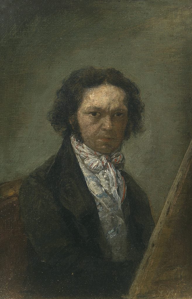 A self-portrait by Francisco Goya showing himself in a fancy suit, hair framing his face, and a stern look
