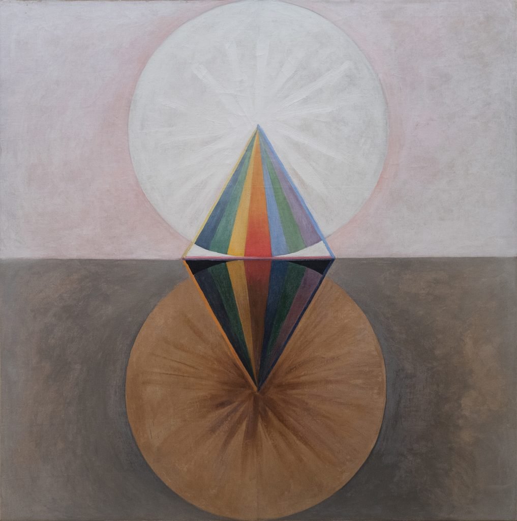 An abstract painting of a white circle on a pink background and a brown circle on a dark brown background. Intersected by a rainbow segment. By Hilma af Klint