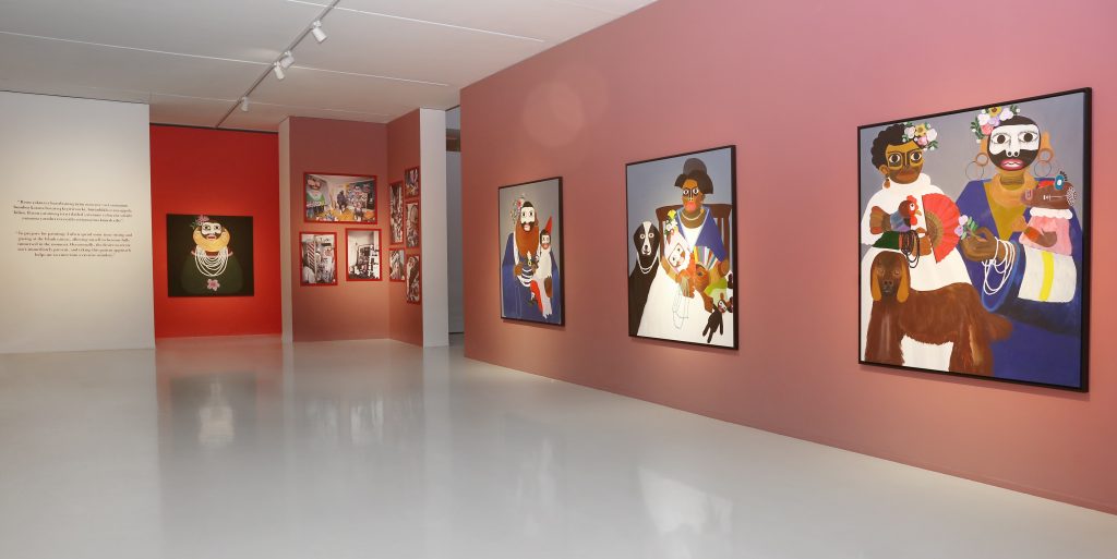 Two walls of inside the Kojo Marfo exhibition with a series of paintings.