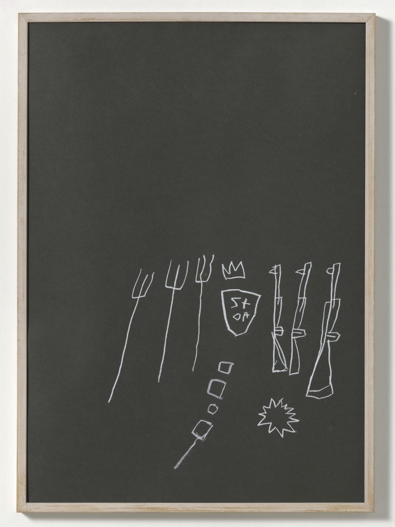 White chalk drawings of riffles, pitchforks, and a crown on a blackboard.