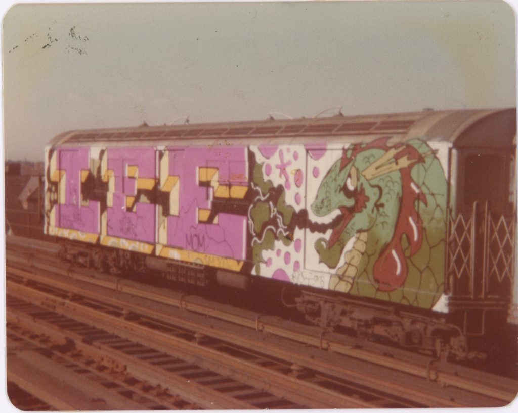 An old photograph of a New York subway car entirely covered by a mural that reads "LEE."