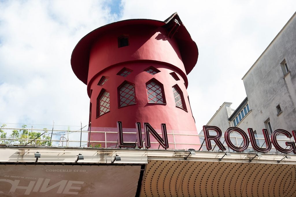 The iconic red windmill atop the Paris nightclub the Moulin Rouge after its blades fell off
