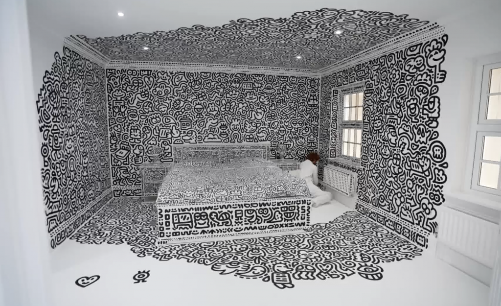 A man doodles over every surface in a bedroom.