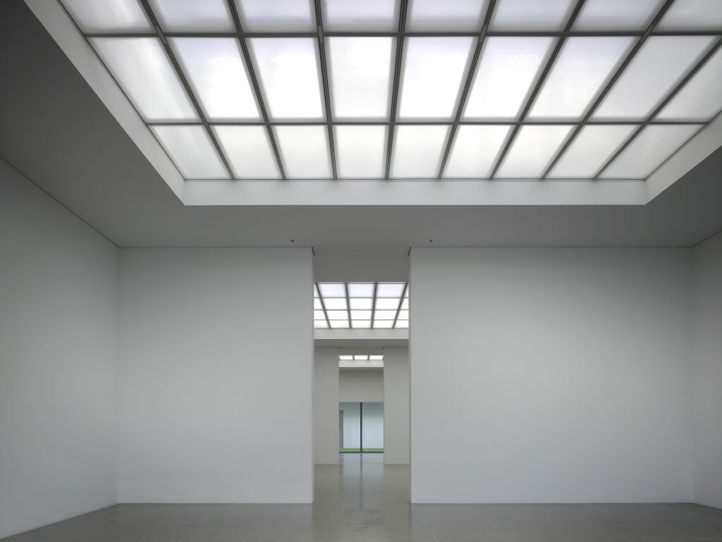 photograph of an empty museum interior with sky light