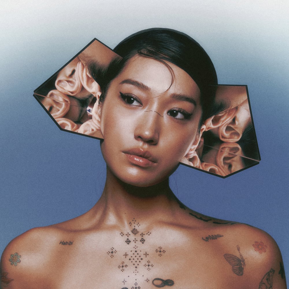 musician Peggy Gou with mirror piece affixed behind ears.
