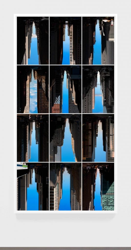 A grid of 12 photographs where the blue seen through the framing of city buildings appears to be the same shape as a skyscraper. Featured at the Photography Show.
