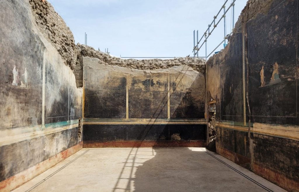 A dining room, painted black, just excavated from the Pompeii archaeological site.