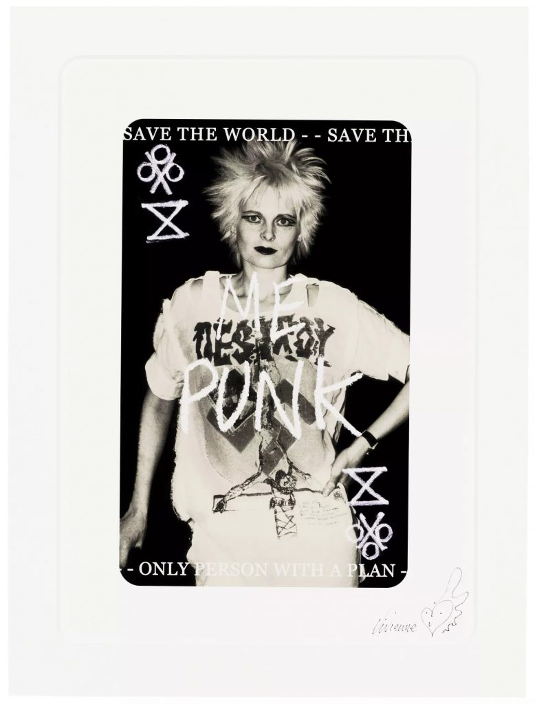 A playing card showing a woman with a spiky haircut and wearing distressed shirt. The words "ME PUNK" are scrawled over the image.