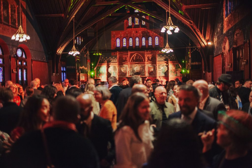 photograph of a crowd inside the former church of the epiphany in chicago