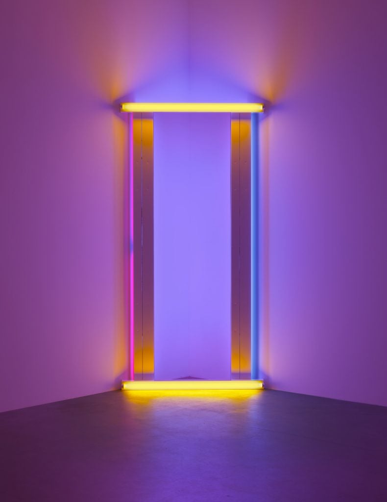 a light installation with purple background and yellow, pink, and blue rectangular lights