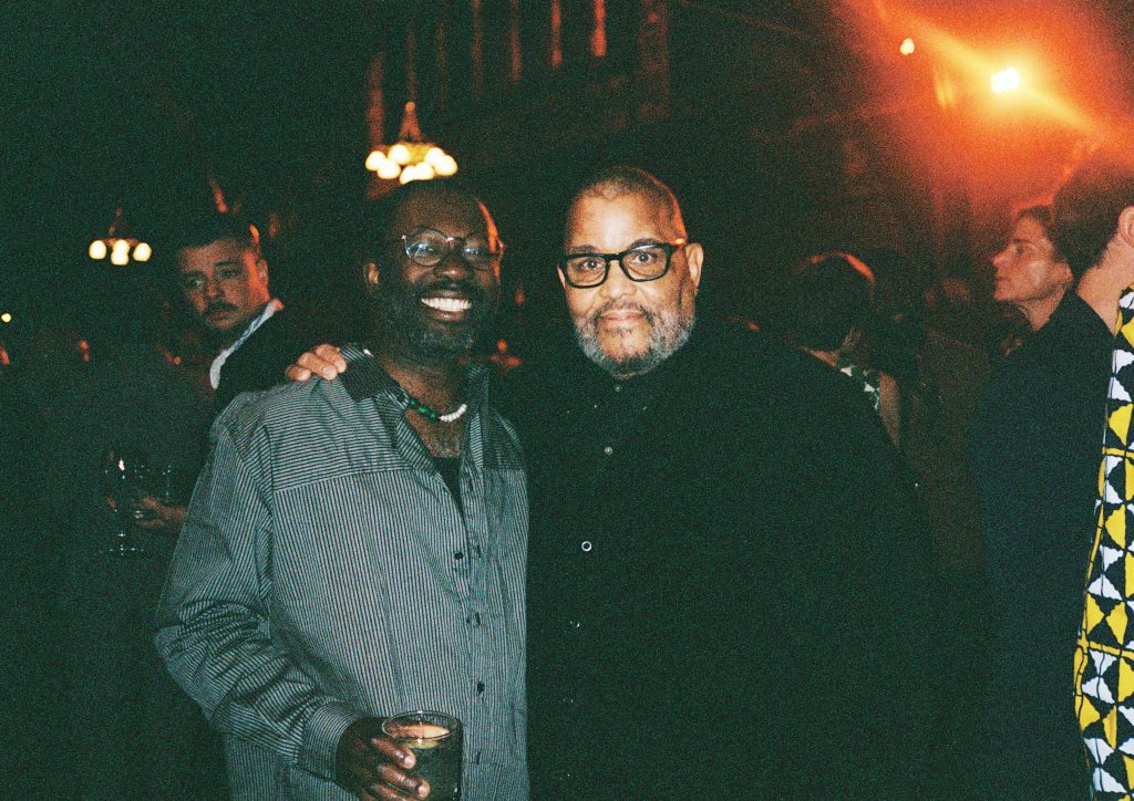 photograph of paul mpagi sepuya and dawoud bey smiling at the camera