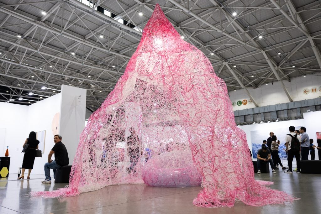 a large pink installation at an art fair
