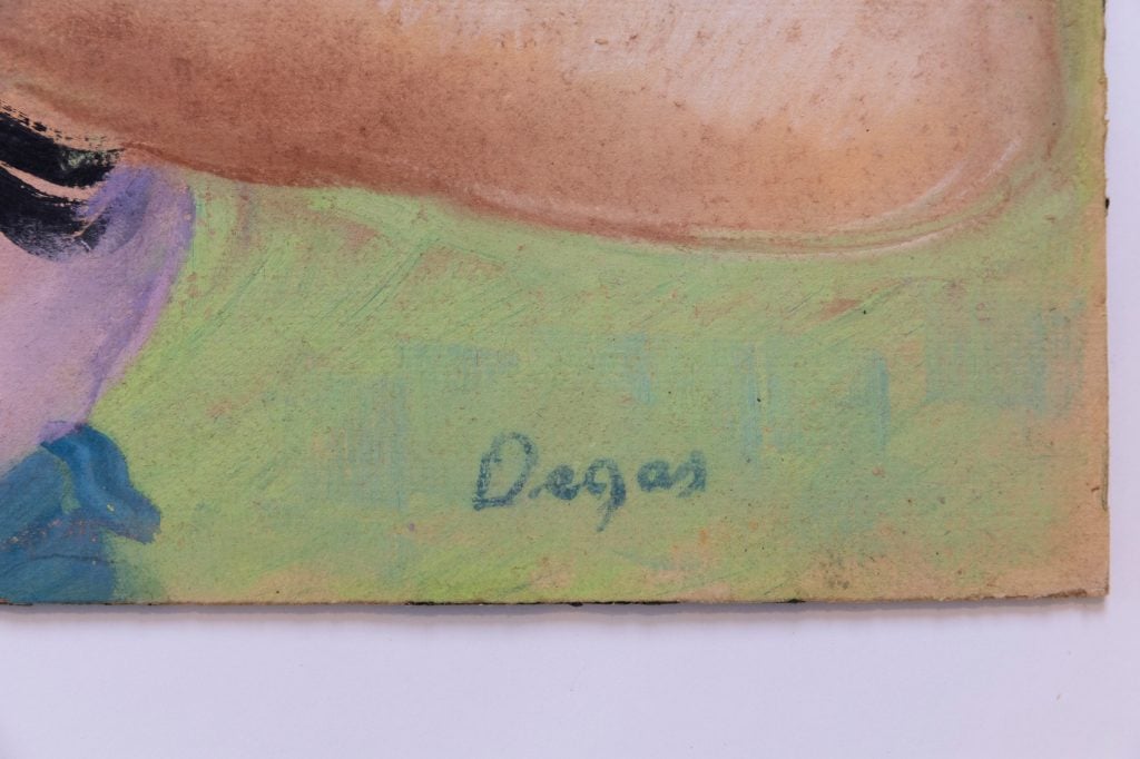 the corner of a pastel drawing which clearly shows the word "Degas" written out in dark blue against the light green ground