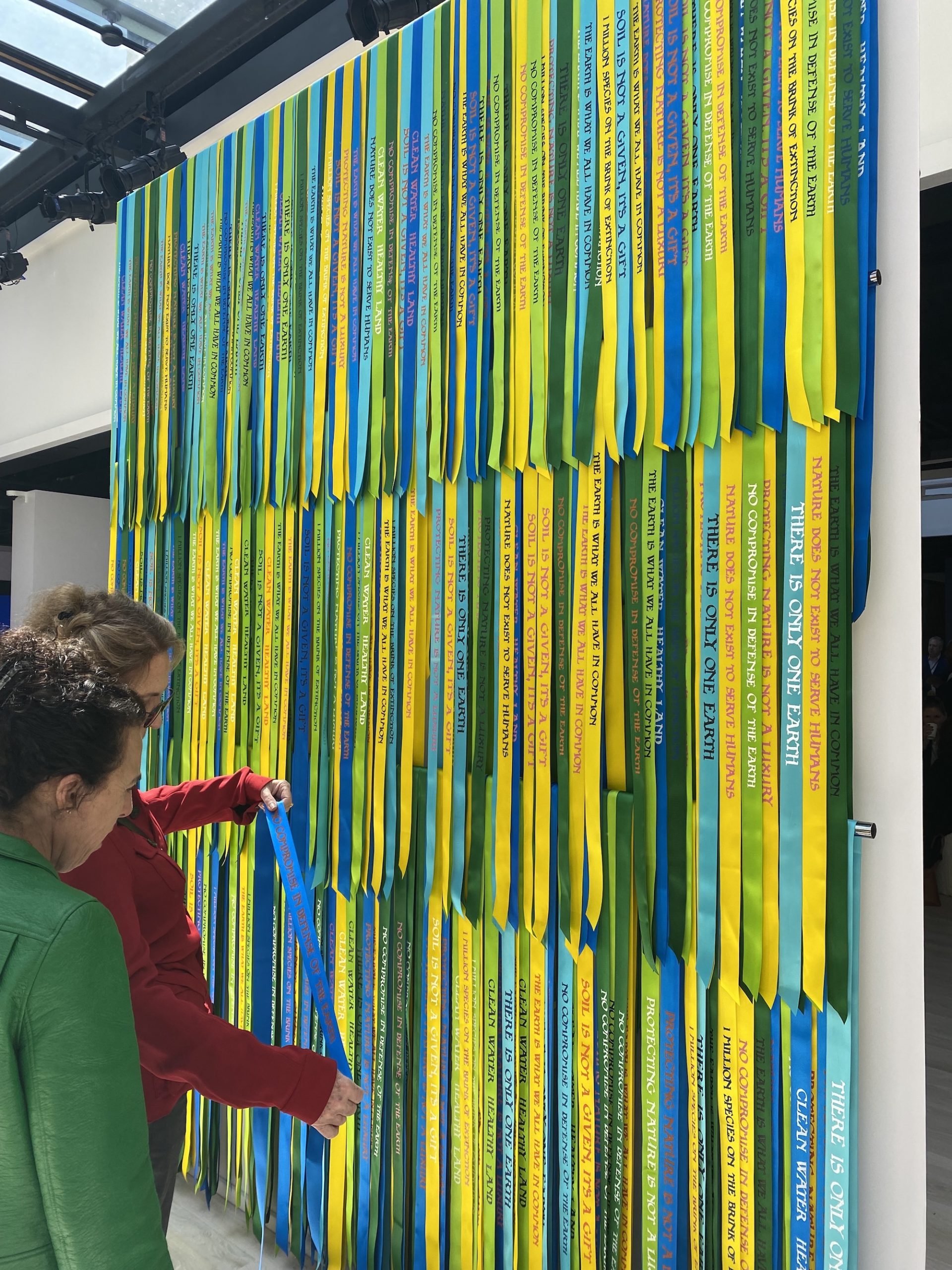 an artwork of hanging ribbons installed at Frieze New York