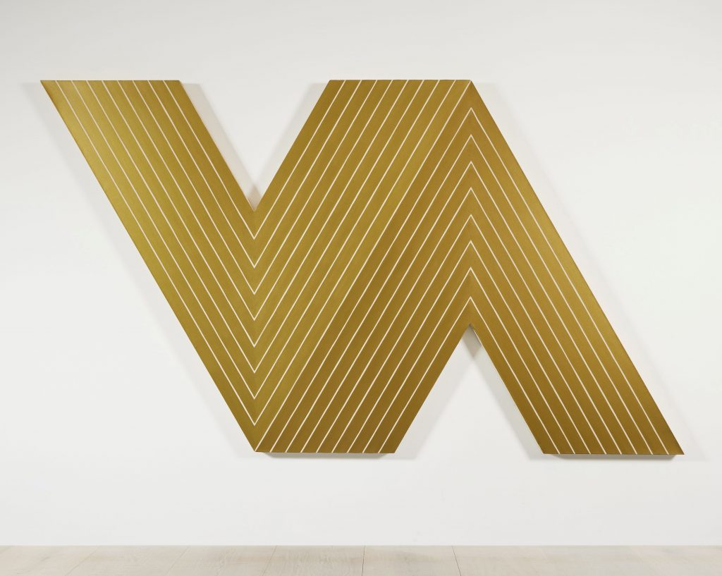 golden v-shaped canvas by Frank Stella