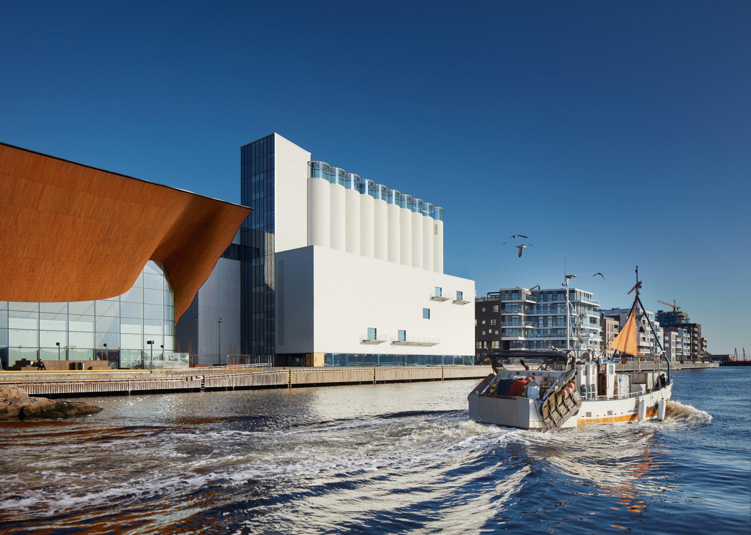 image of a white building by the waterfront