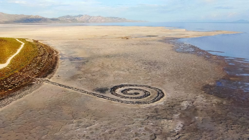 a jetty made of black basalt rocks in a spiral shape in the Great Salt Lake in Utah