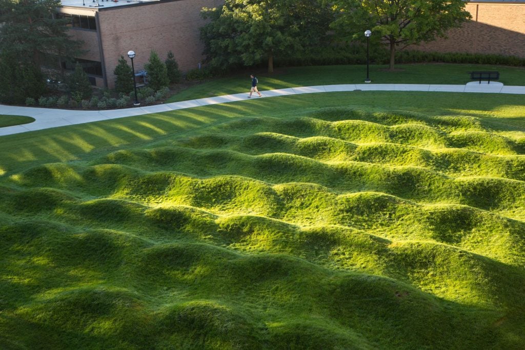 Maya Lin's outdoor grass installation contains mounds of earth covered by green grass