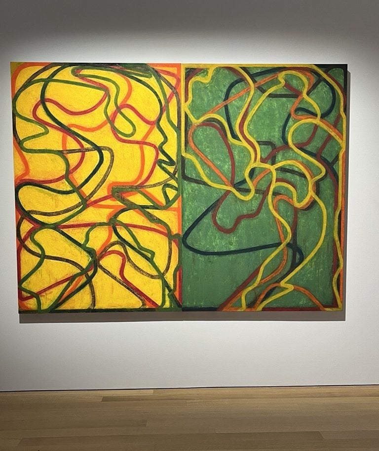 abstract painting with snaking lines on yellow and green background