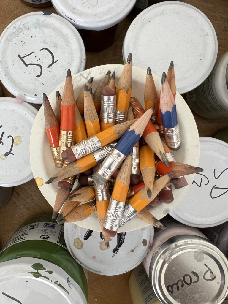 a bowl of pencils worn down to their nubs.