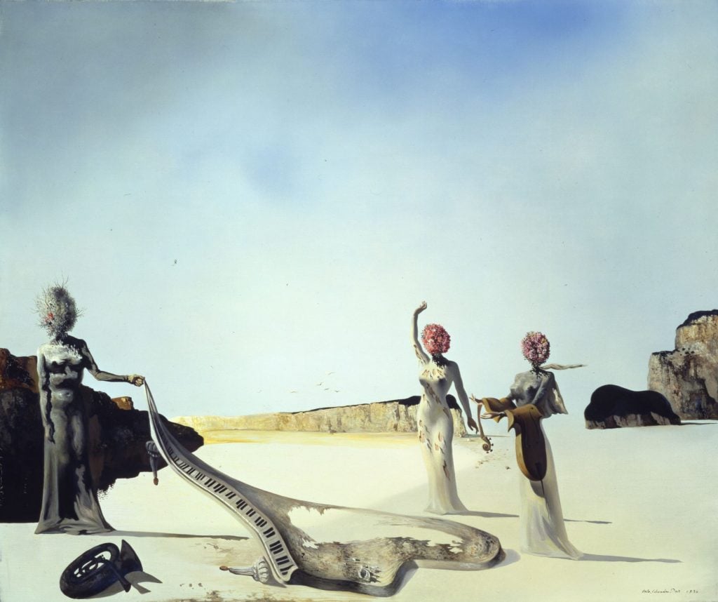 A painting by Salvador Dalí of three women with flowers for heads standing in a bleak landscape