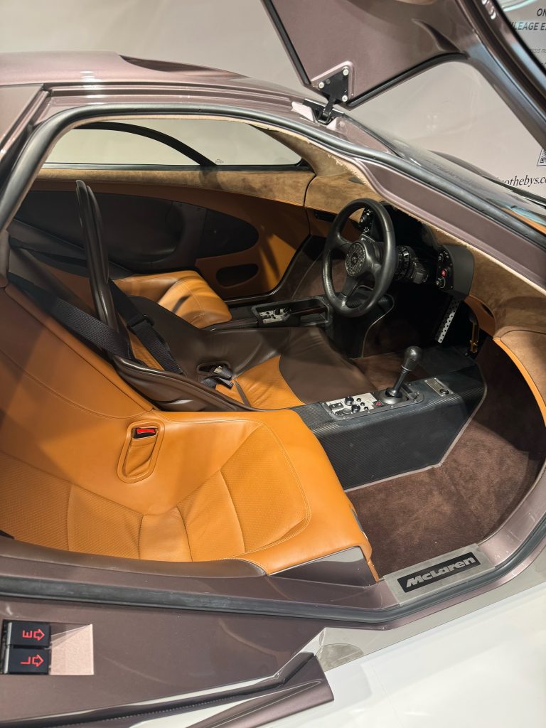 A photo of a fancy car, with a door open