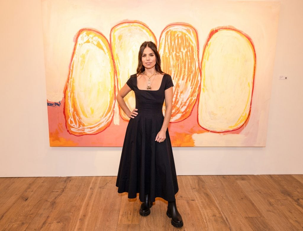 portrait of alexandria hilfiger in front of her painting