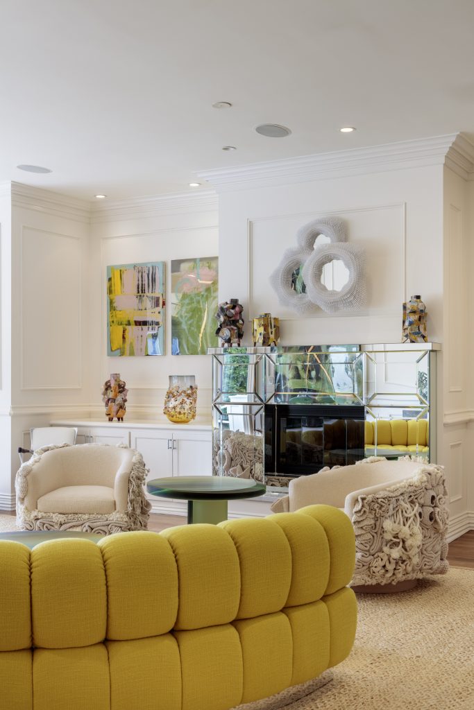 A maximalist living room with eclectic design and a mustard yellow velvet sofa