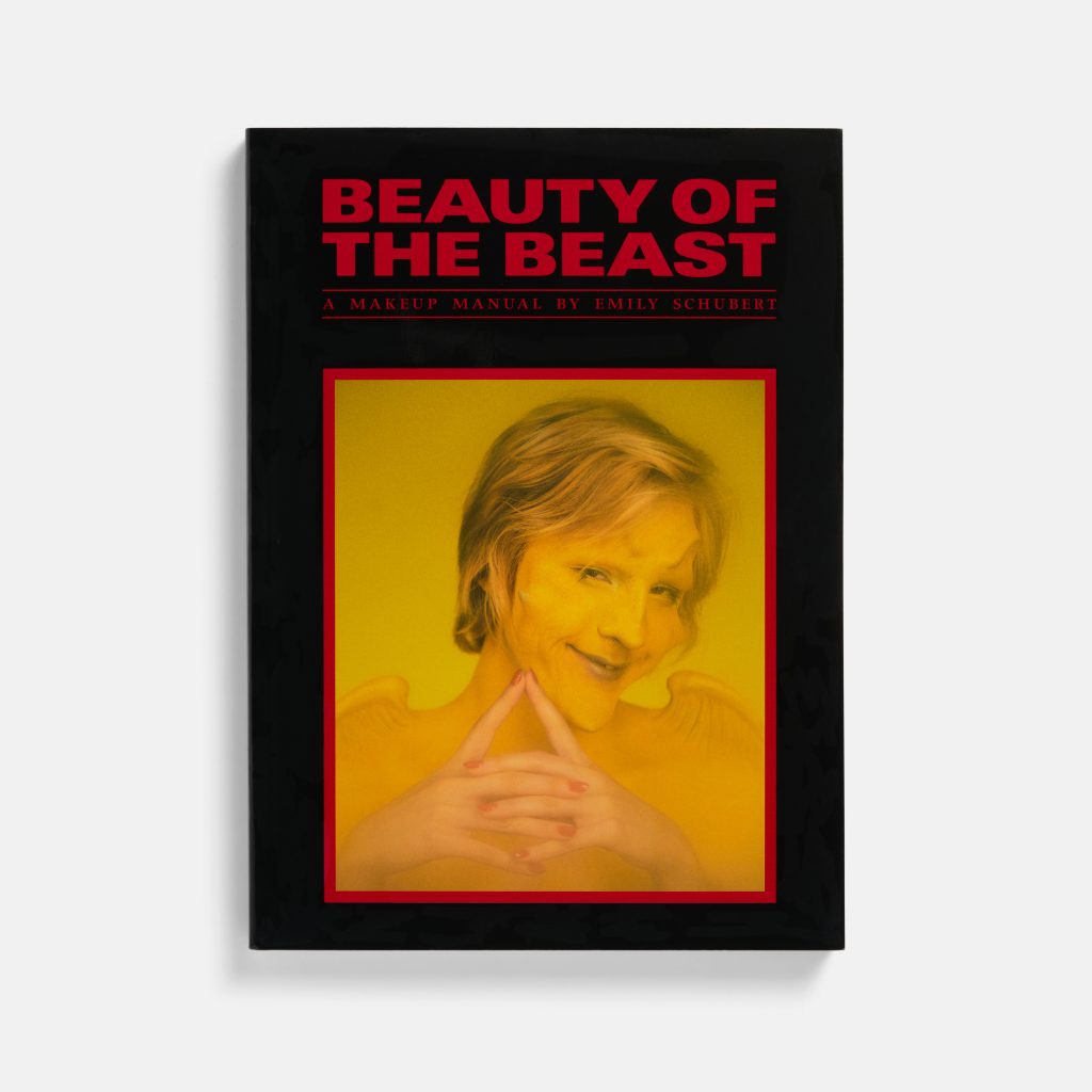 The cover of a black book with the title "Beauty of the Beast" on top of an image of a man made up with bony prostheses on his face