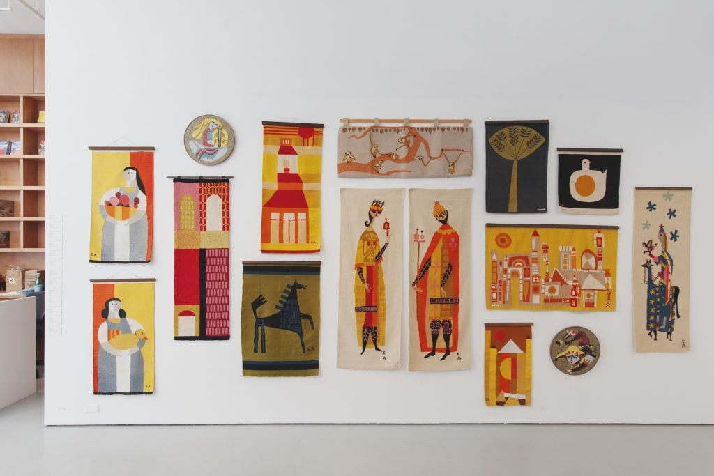 A number of small fiber artworks on view in a gallery