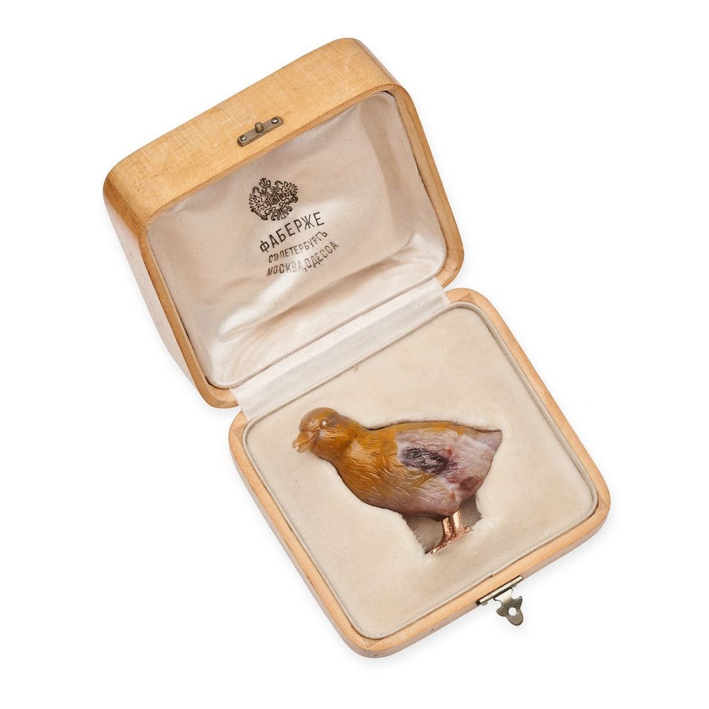 An agate carving of a duckling in a luxurious box