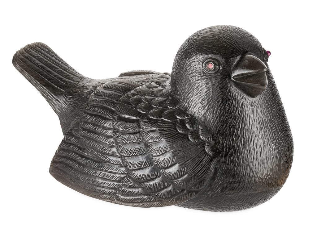 An obsidian carving of a sparrow