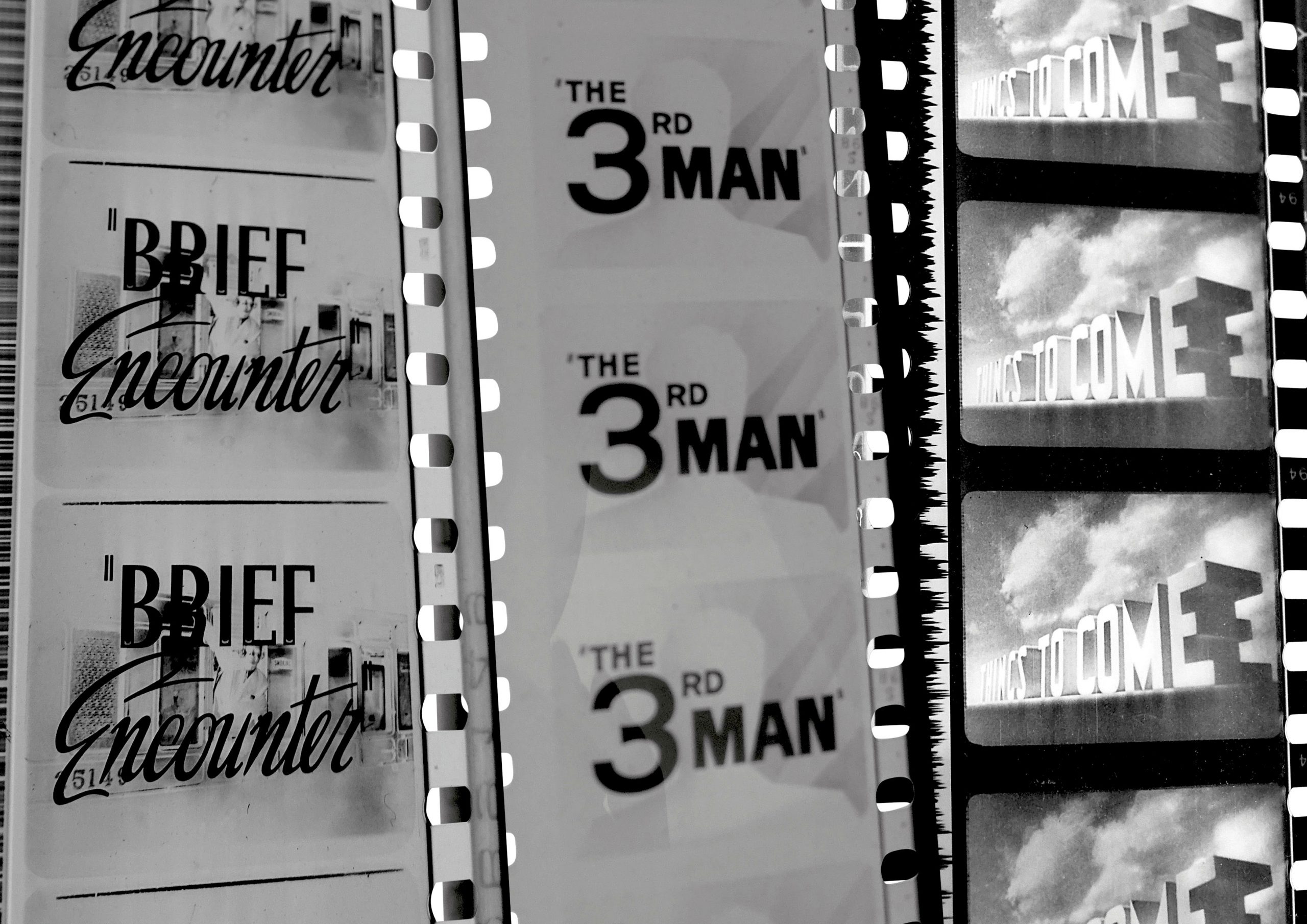 Three black and white film reels showing titles that read "Brief Encounter," "The 3rd Man," and "Things to Come."