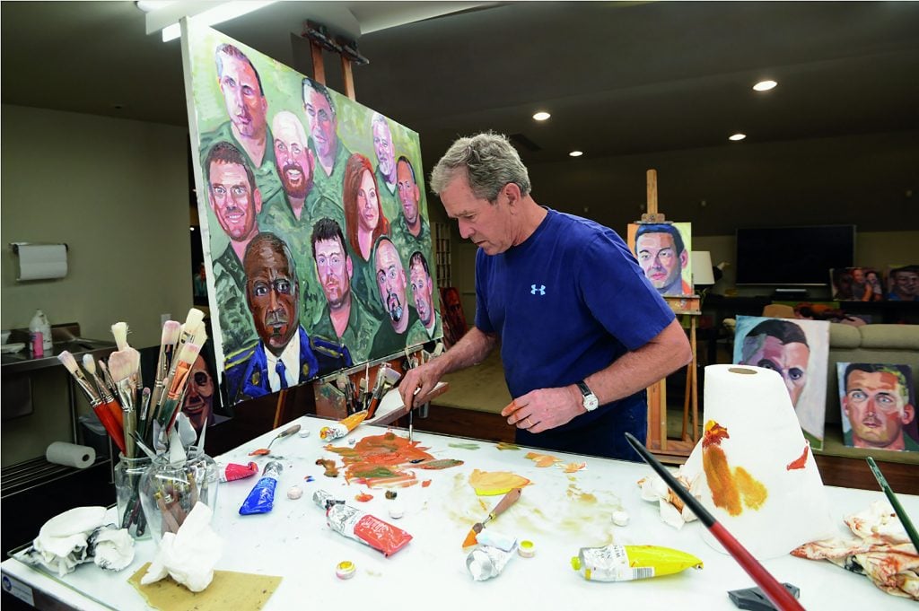 Former president George W. Bush at work on a painting