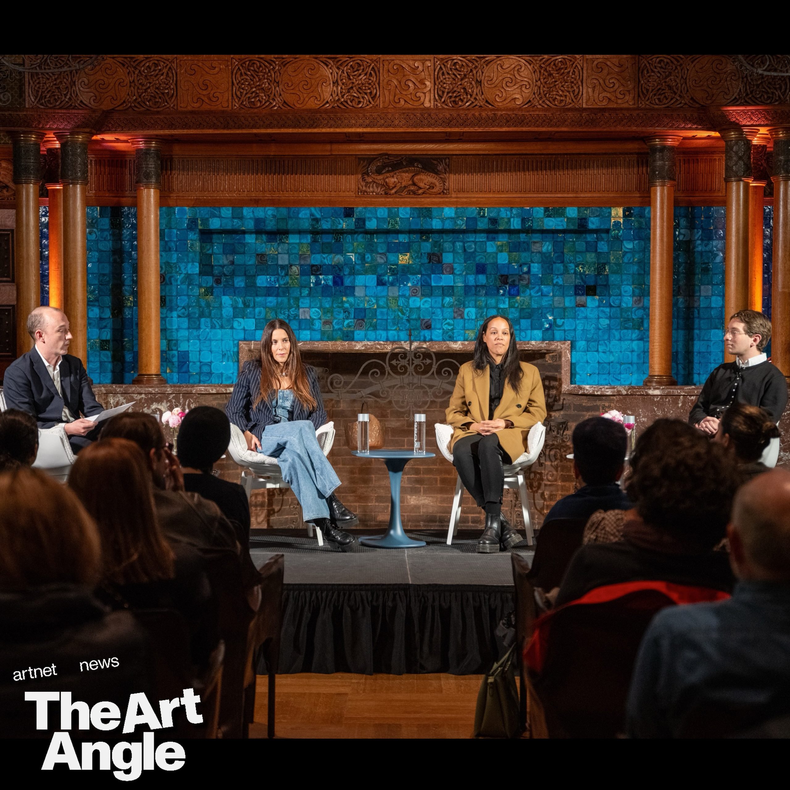 three people sit on a panel in front of a blue and wood background