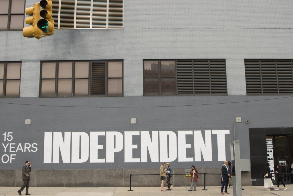 A grey building with the word "Independent" printed on it in white