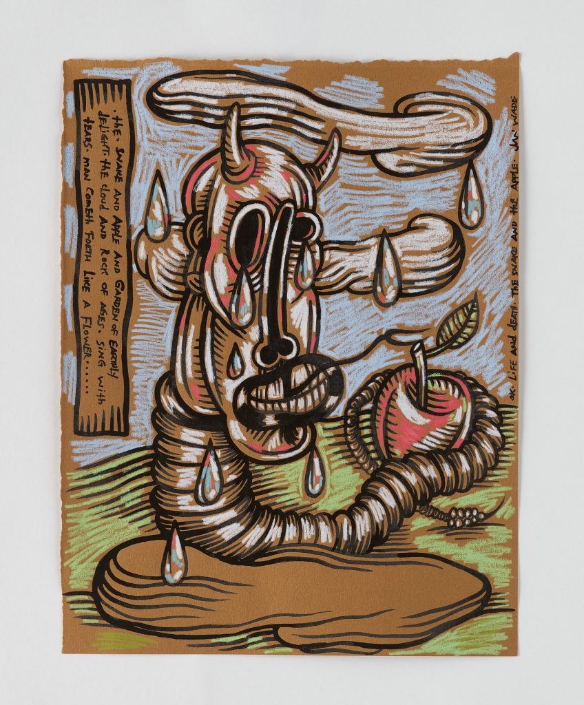 Jan Wade painting featuring a cartoon skull with a worm tail wrapped around an apple, sitting on a rock with a blue sky in the background.