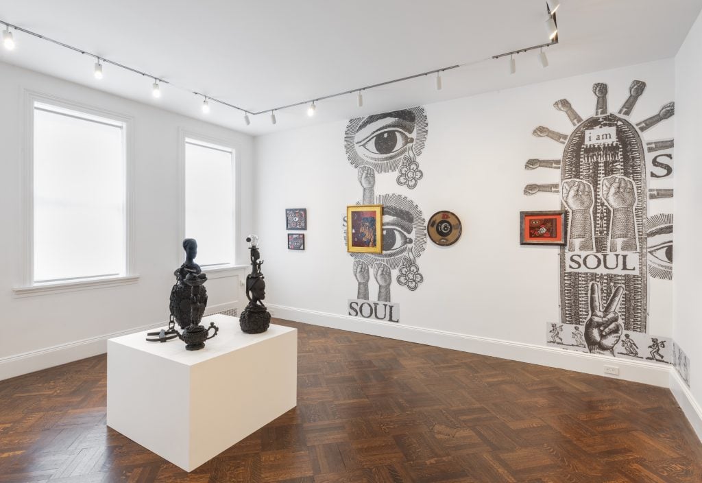 photograph of mix media work in a white gallery space