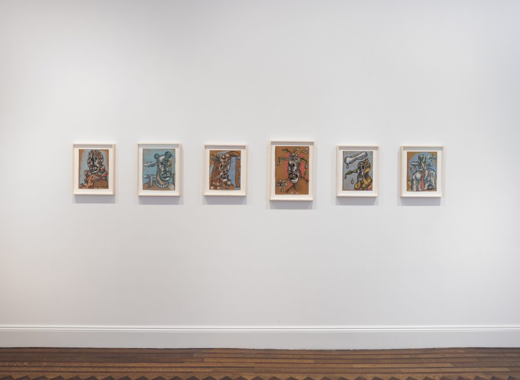 photograph of six paintings hung on a white wall by artist jan wade