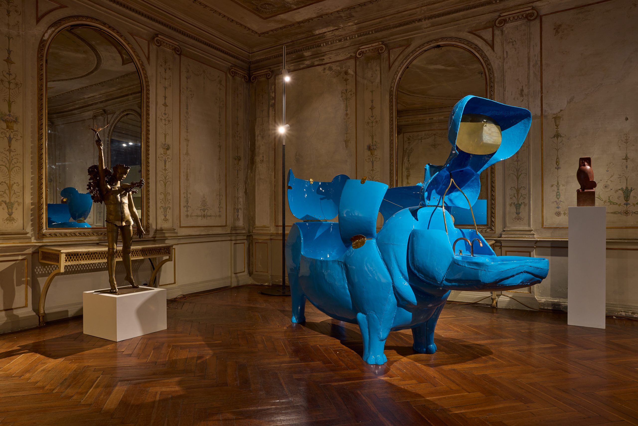 A series of sculptures and home decor by Les Lalanne set within a historic palazzo.