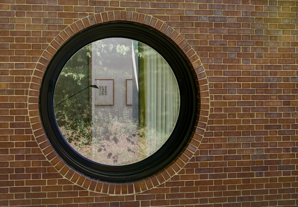 A porthole in a brick wall