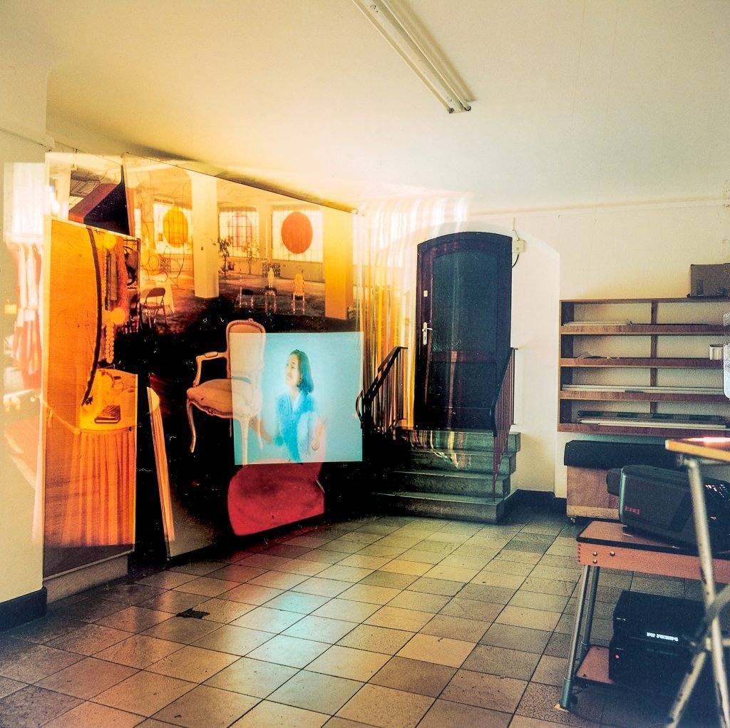 photograph of a studio with a projection on the wall