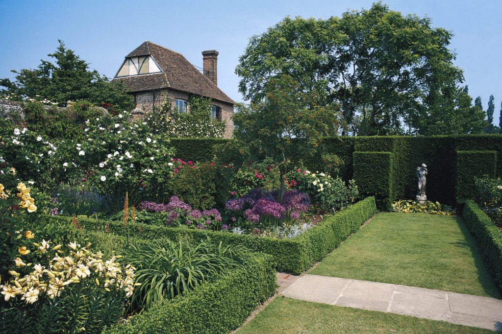 photograph of a garden and a house